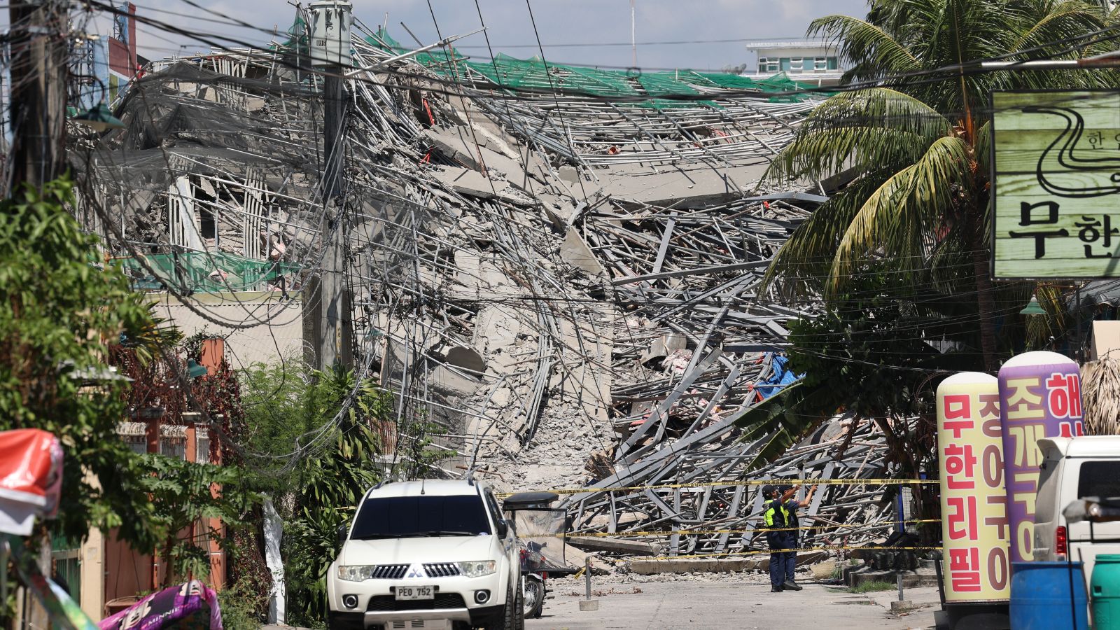 Dozens feared trapped after nine-storey building collapses in the Philippines