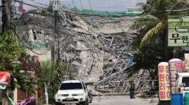 Caution tape marks the area around a collapsed building in Angeles city in Pampanga province, north of Manila, Philippines. (AP Photo)