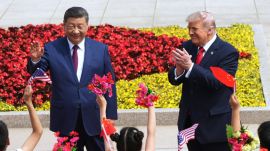 President Donald Trump and China's President Xi Jinping greet children during a welcome ceremony at the Great Hall of the People, Thursday, May 14, 2026, in Beijing. (AP Photo)