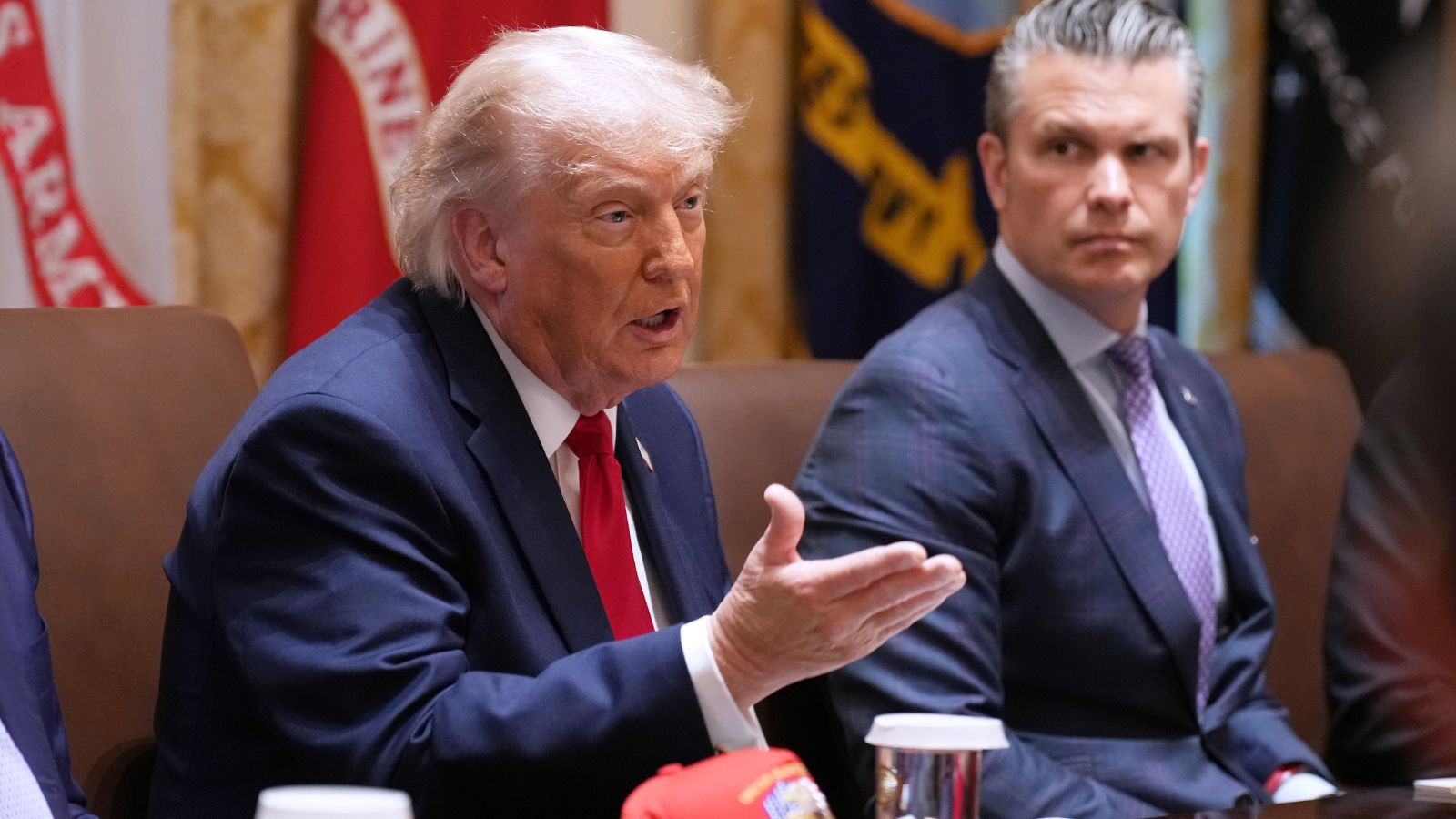US President Donald Trump speaks during a Cabinet meeting at the White House, Wednesday, May 27, 2026, in Washington, as Secretary of Defense Pete Hegseth, looks on. (AP Photo)