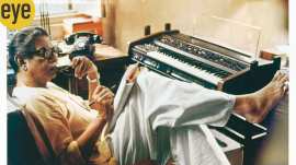 Ray composed music on a synthesiser at home
