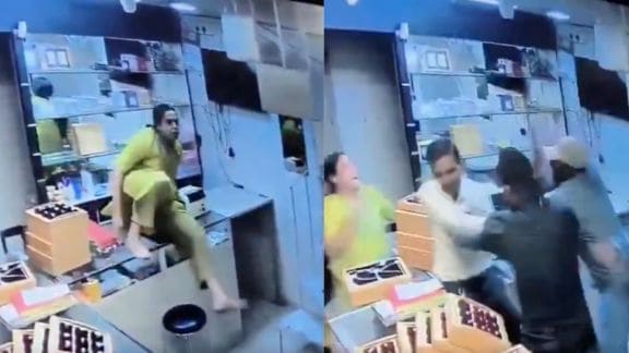 Despite the frightening sight, the three staff members can be seen fighting back