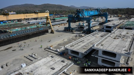 Labourers work at a girder casting yard at Dahanu, Palghar district in Maharashtra on 20 March 2026.