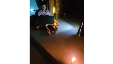 Tamizh Amudhan can be seen sitting on the floor of his Thiruthangal house (a suburb of Sivakasi), legs outstretched, laptop propped up on a pillow, and the room only lit by the feeble flicker of a candle. (Image via special arrangement)