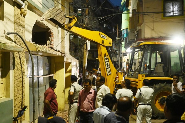 Bulldozers and earthmovers were deployed by the authorities in Tiljala to demolish the allegedly illegal structure where two people lost their lives in yesterday’s fire incident.Express photo.