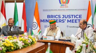 Union Law and Justice Minister Arjun Ram Meghwal delivers the welcome address during the opening session of the two-day BRICS Justice Ministers’ Meeting 2026, in Gandhinagar.