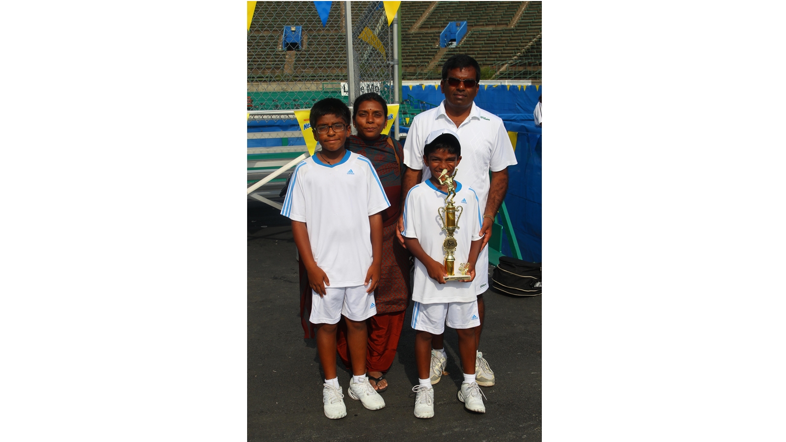 A young Nishesh Basavareddy with his parents Muralikrishna Basavareddy and Sai Prasanna Basavareddy and elder brother Nishanth Basavarddy. (Image via special arrangement)