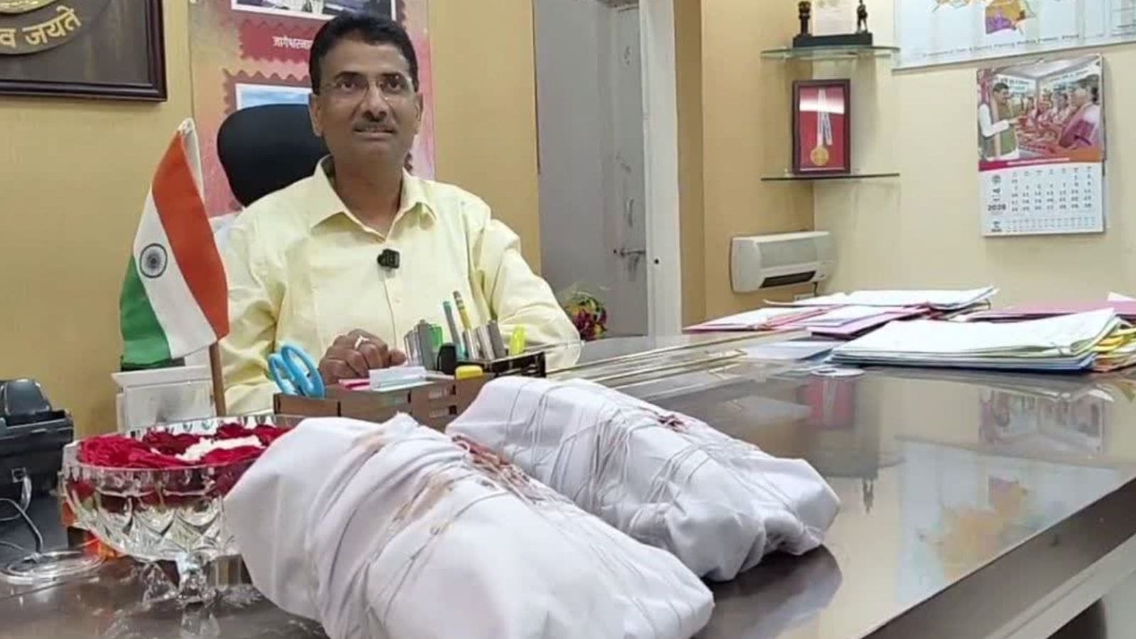 Damoh Collector Pratap Narayan Yadav uncovered an alleged surveillance breach inside his office after using a mobile phone and live news broadcast to detect possible bugging.