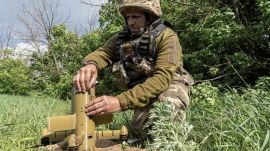 A Ukrainian soldier prepares an interceptor drone during a Russia's aerial attack at an undisclosed location near Kharkiv, Ukraine. (AP Photo)