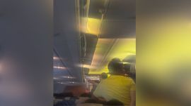 Passengers wait inside the sweltering cabin of Air India Express flight IX-1230 as the aircraft remained grounded at Delhi airport for over three hours on Tuesday. (Credit: Shahid Algur/ X)