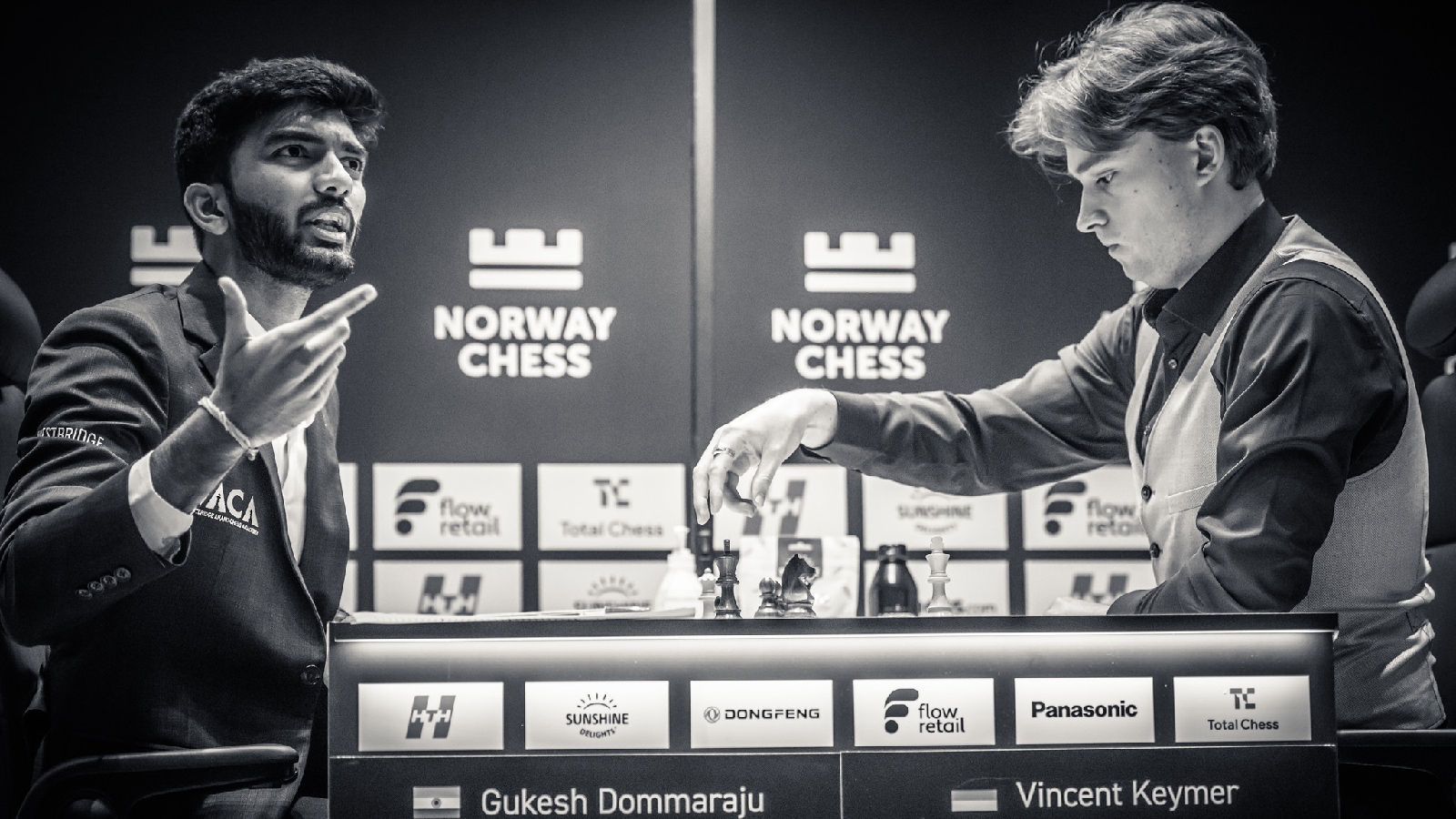 World champion D Gukesh speaks to the arbiter while his opponent Vincent Keymer contemplates his next move during their round 1 game at the Norway Chess tournament in Oslo. (Photo: Michal Walusza/Norway Chess)