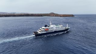 A drone view of the cruise ship MV Hondius, carrying passengers suspected of having cases of hantavirus on board, leaves Praia, Cape Verde, May 6, 2026. (REUTERS)