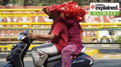 People protecting themselves from the heat in Ahmedabad.