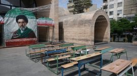 A banner with a picture of Irans new Supreme Leader, Mojtaba Khamenei, next to a symbolic classroom of the Minab school students who were killed in a strike, in Tehran, Iran, on May 8, 2026. (REUTERS)
