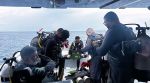This image released by the Maldives President's Media Division, shows divers preparing to search for the four missing Italian divers near Alimathaa Island, Vaavu Atoll, Maldives, Saturday, May 15, 2026. (Maldives President's Media Division via AP)