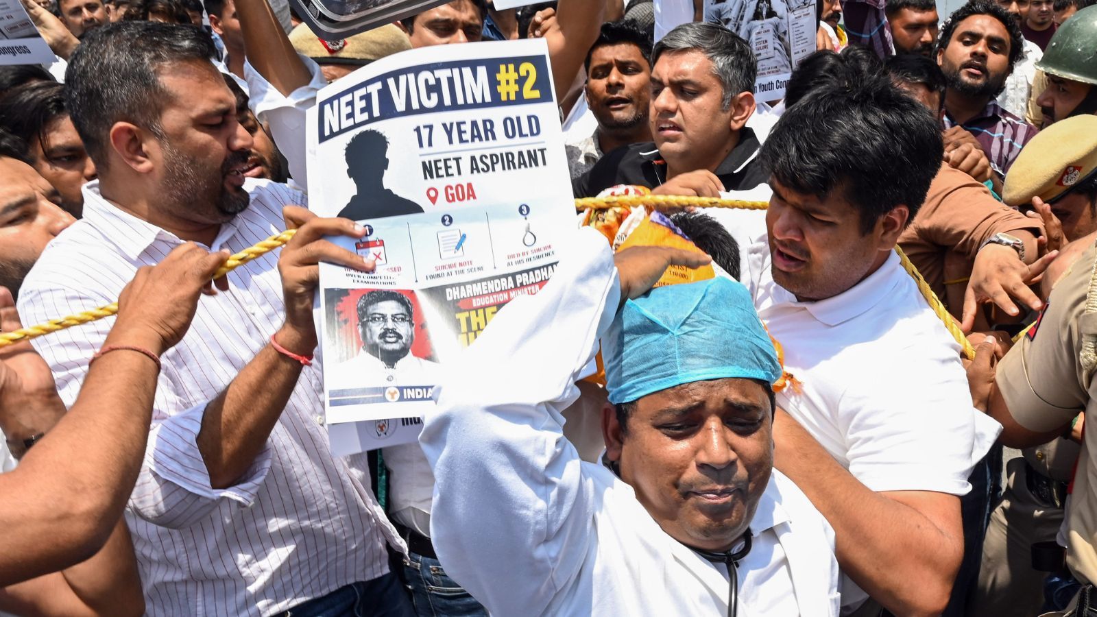 Indian Youth Congress (IYC) activists protest against Union Minister Dharmendra Pradhan over the alleged NEET-UG 2026 paper leak at Teen Murti Circle, in New Delhi on Saturday. (ANI Photo)