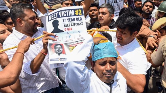 Indian Youth Congress (IYC) activists protest against Union Minister Dharmendra Pradhan over the alleged NEET-UG 2026 paper leak at Teen Murti Circle, in New Delhi on Saturday. (ANI Photo)