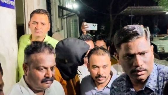 Nashik [Maharashtra], May 12 (ANI): The accused, Shubham Khairnar, being taken into custody by the CBI officials from the Nashik Crime Branch Unit-2 office in connection with the alleged NEET-UG 2026 paper leak, in Nashik on Tuesday. (ANI Video Grab)