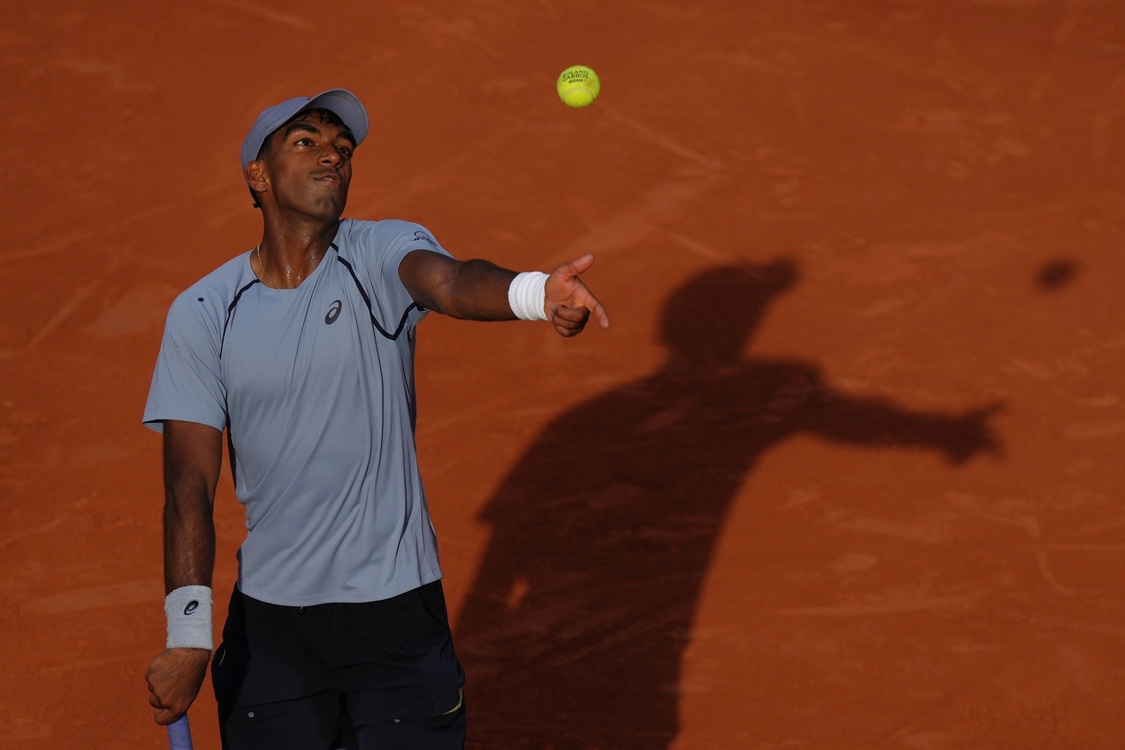 Nishesh Basavareddy serves to Taylor Fritz during their first round men's singles tennis match at the French Open. (AP Photo)
