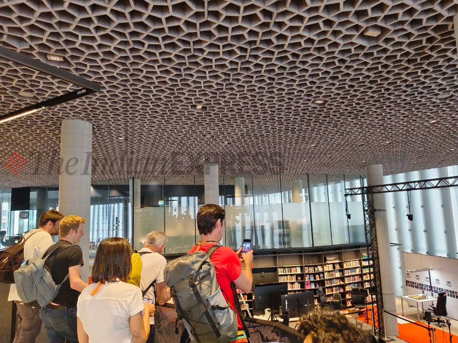 Local chess fans click photos of the playing arena set up at the Deichman Bjørvika, a public library at Oslo. (Express photo by Amit Kamath)
