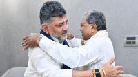 Karnataka Chief Minister Siddaramaiah is greeted by Deputy Chief Minister DK Shivakumar during a breakfast meeting at the Chief Minister's official residence, in Bengaluru. (PTI Photo)
