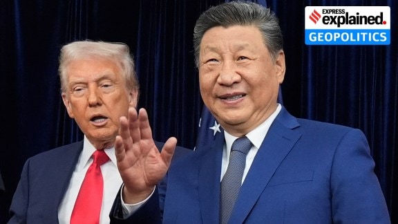 China's President Xi Jinping, right, waves, with US President Donald Trump, in Busan, South Korea, Thursday, Oct. 30, 2025.
