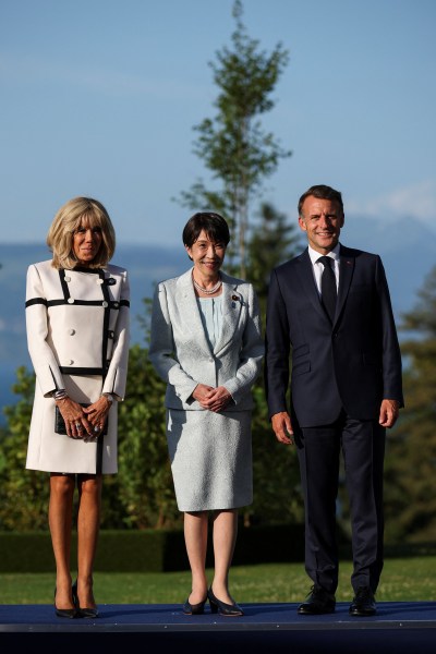French President Emmanuel Macron and his wife Brigitte Macron pose with Japanese Prime Minister Sanae Takaichi during the G7 summit. (REUTERS)
