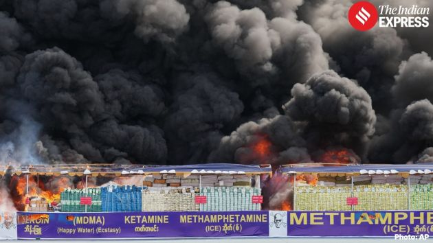 Thick black smoke billows into the sky on the outskirts of Yangon as authorities burn more than 50 tonnes of drugs