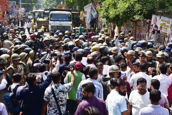 Heavy Police force deployed also Lathi charge during Lucknow Municipal Corporation demolishing allegedly unauthorised chambers near the High Court complex in Kaiserbagh area of Lucknow. (Express Photo by Vishal Srivastav)