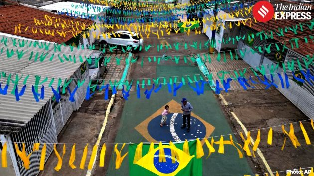 Brazilian flags hang above a street as residents decorate the city in Brasilia, Brazil