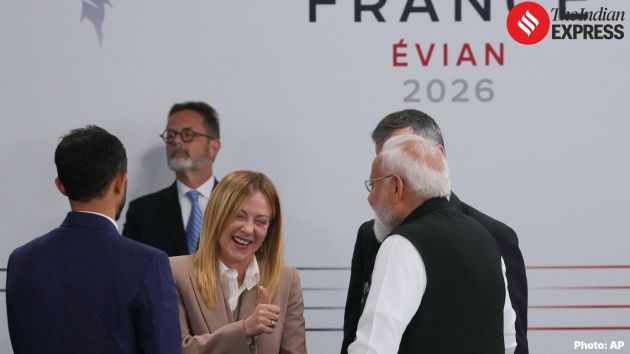 Italian Prime Minister Giorgia Meloni, center, speaks with India's Prime Minister Narenda Modi