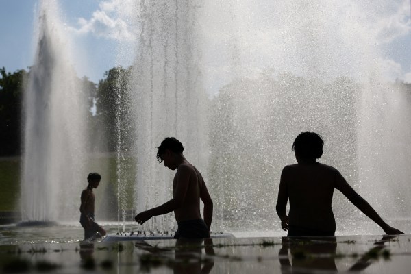 Children cool off in the Trocadero Fountain next to the Eiffel Tower in Paris as temperatures rise during a heatwave affecting a large part of France, June 22, 2026. (REUTERS)