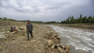 In Kashmir village once known for its springs, mining leaves river scarred, fields barren