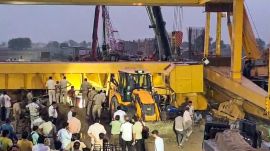 A crane overturned during the construction of the Jewar Airport flyover near Pahneda Khurd, in Faridabad on Thursday. Rescue operations are ongoing. (ANI Video Grab)