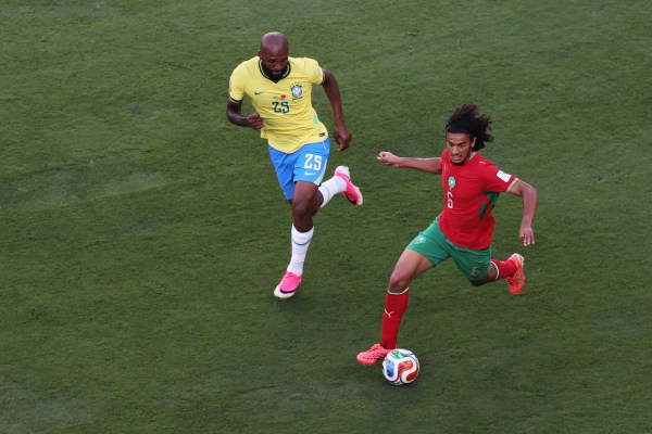 Morocco's Ayyoub Bouaddi, right, dribbles past Brazil's Igor Thiago during the World Cup Group C match. (AP Photo/Pamela Smith)