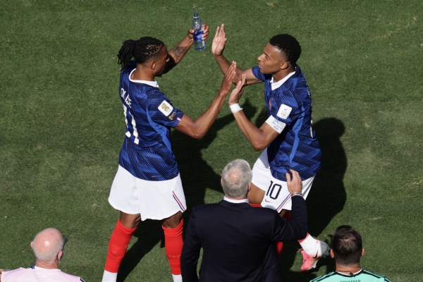 Michael Olise, left, and Kylian Mbappe celebrate after scoring the opening goal during the World Cup Group I match between France and Senegal in East Rutherford. (AP Photo/Adam Hunger)
