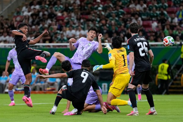 Mexico's Luis Romo (7), left, scores the 50th-minute goal for Mexico against South Korea. (AP Photo)