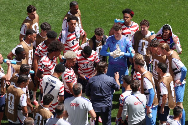 United States head coach Mauricio Pochettino, center, speaks to his players during a hydration break during the World Cup Group D  match against Australia in Seattle. (AP Photo/Maddy Grassy)