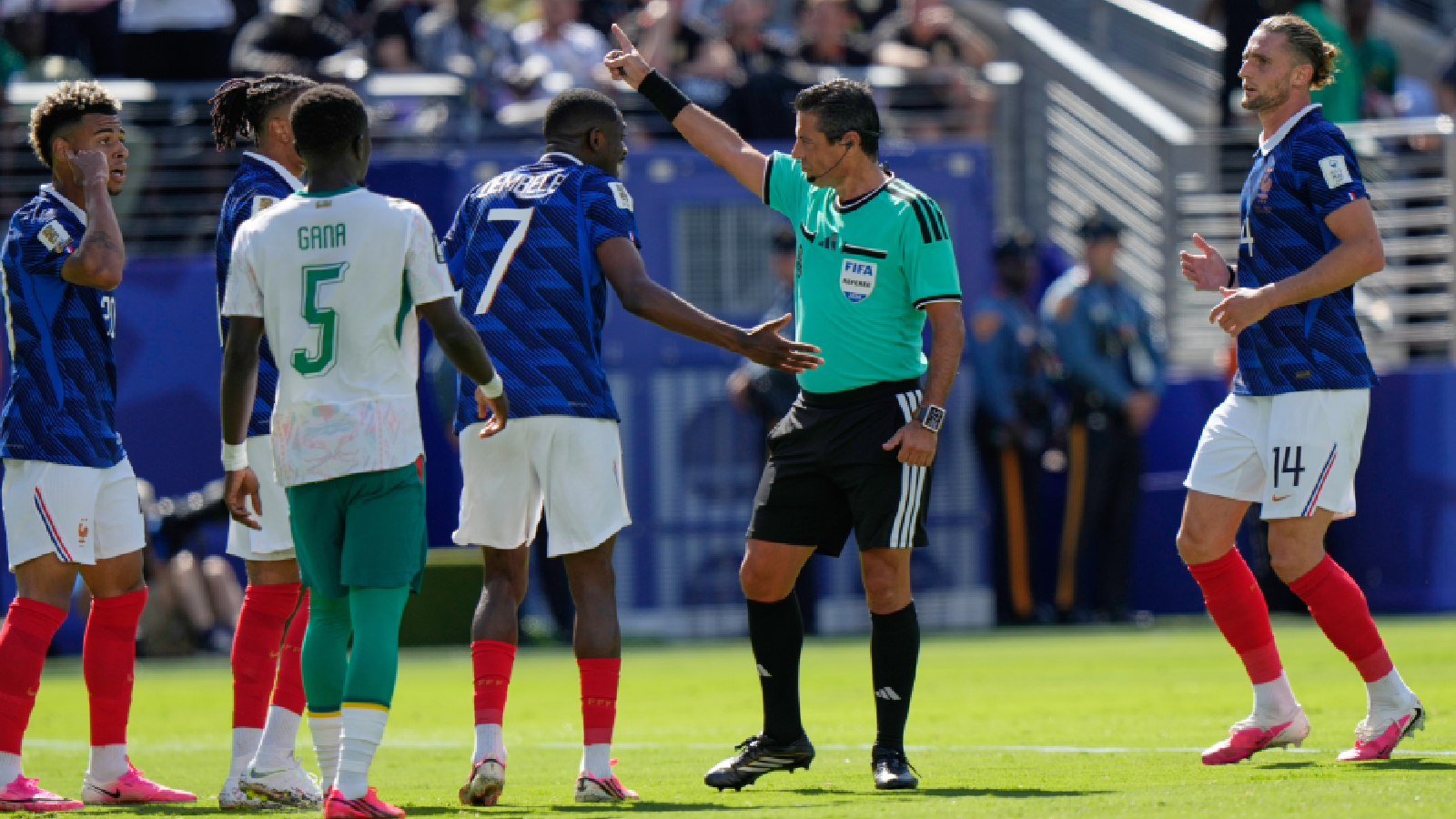Referee Alireza Faghani, gestures as France's Ousmane Dembele (7) argues during the World Cup Group I soccer match between France and Senegal in East Rutherford, N.J., near New York, Tuesday, June 16, 2026. (AP Photo/Steve Luciano)