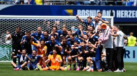 Bosnia players pose for a photo after their victory against Qatar in the World Cup Group B soccer match in Seattle, Wednesday, June 24, 2026. (AP Photo/Lindsey Wasson)