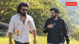 Buchi Babu Sana with Ram Charan during the shooting of Peddi