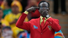 Congo supporter Michel Nkuka Mboladinga, poses dressed as the country's assassinated independence hero Patrice Lumumba, reacts ahead of the World Cup Group K soccer match between Colombia and Congo in Zapopan, near Guadalajara, Mexico, Tuesday, June 23, 2026. (AP Photo/Natacha Pisarenko )