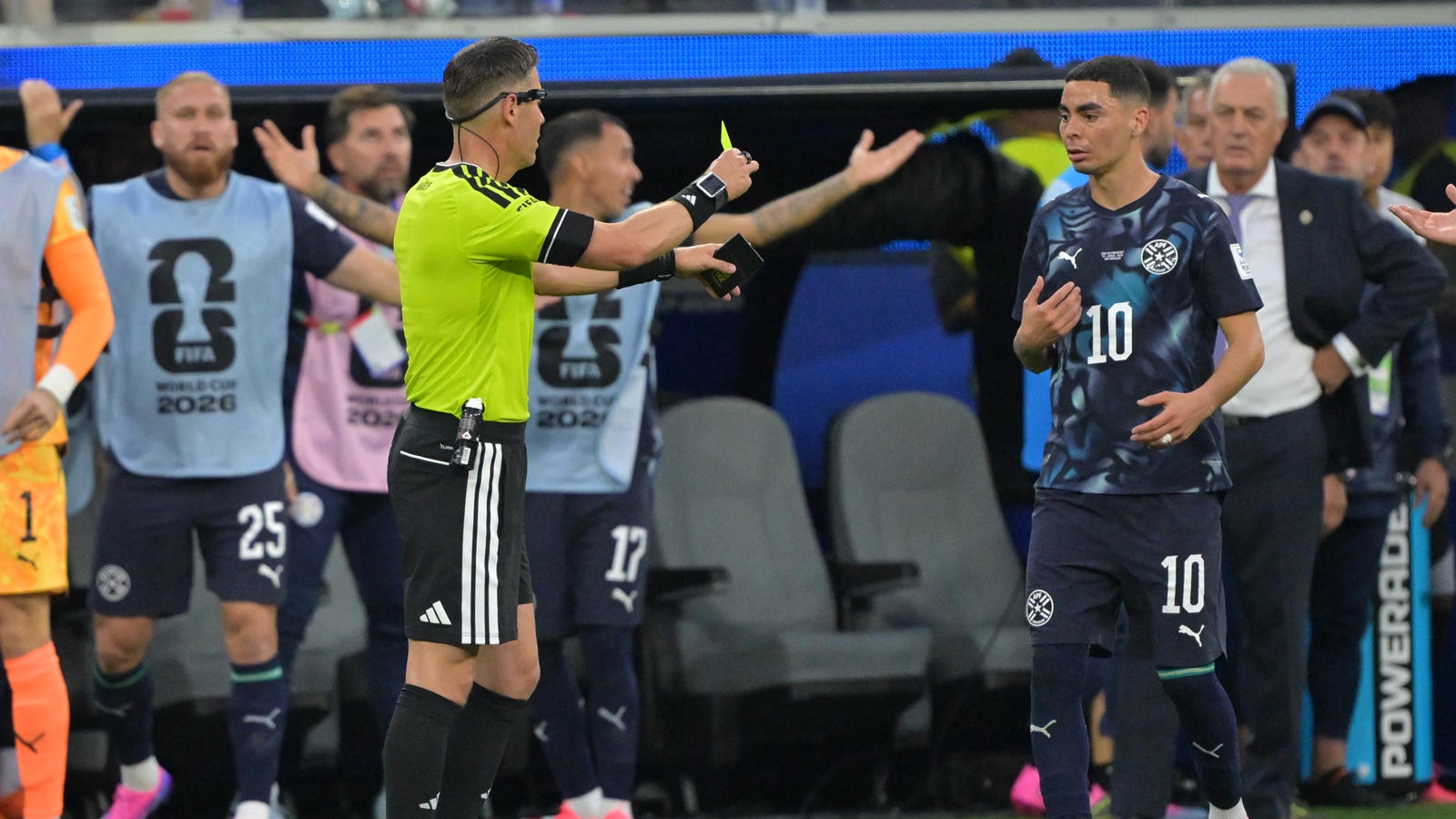 VAR Carlos del Cerro Grande asked on-field Dutch referee Danny Makkelie to go to the pitch-side TV screen. Makkelie subsequently revoked his decision and gave a yellow card to Almiron for ‘simulation’, a euphemism for diving. (AP Photo)