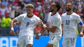 Egypt's Emam Ashour, left, celebrates after scoring the opening goal during the World Cup Group G soccer match between Belgium and Egypt in Seattle, Monday, June 15, 2026. (AP Photo/Manu Fernandez)