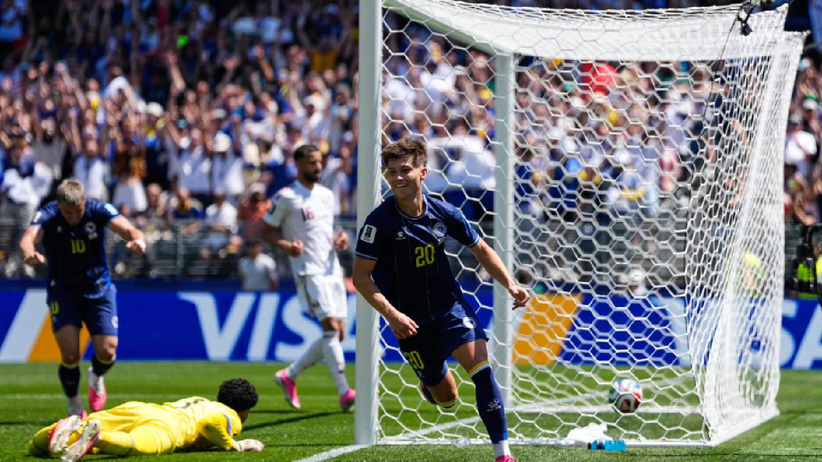Bosnia's Esmir Bajraktarevic, right, celebrates after Qatar's Sultan Albrake scored an own goal during the World Cup Group B soccer match in Seattle, Wednesday, June 24, 2026. (AP Photo/Lindsey Wasson)
