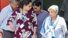Giribala Singh, mother-in-law of Twisha Sharma, being taken out of the CBI office by officials in connection with the Twisha Sharma death case, in Bhopal on Tuesday. She will be produced before the court shortly. (ANI Photo)