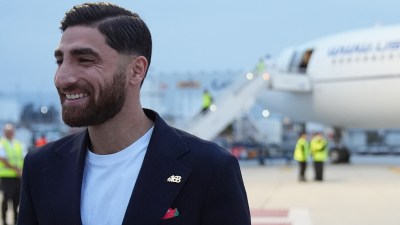 Iran's Alireza Jahanbakhsh smiles as he arrives with his teammates for the World Cup soccer tournament in Tijuana, Mexico, Sunday, June 7, 2026. (AP Photo)