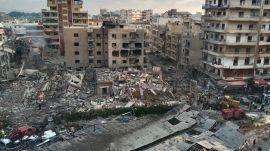 Rescuers work at the site of an Israeli airstrike that hit a building and damaged a hospital in the southern port city of Tyre, Lebanon. (AP Photo)