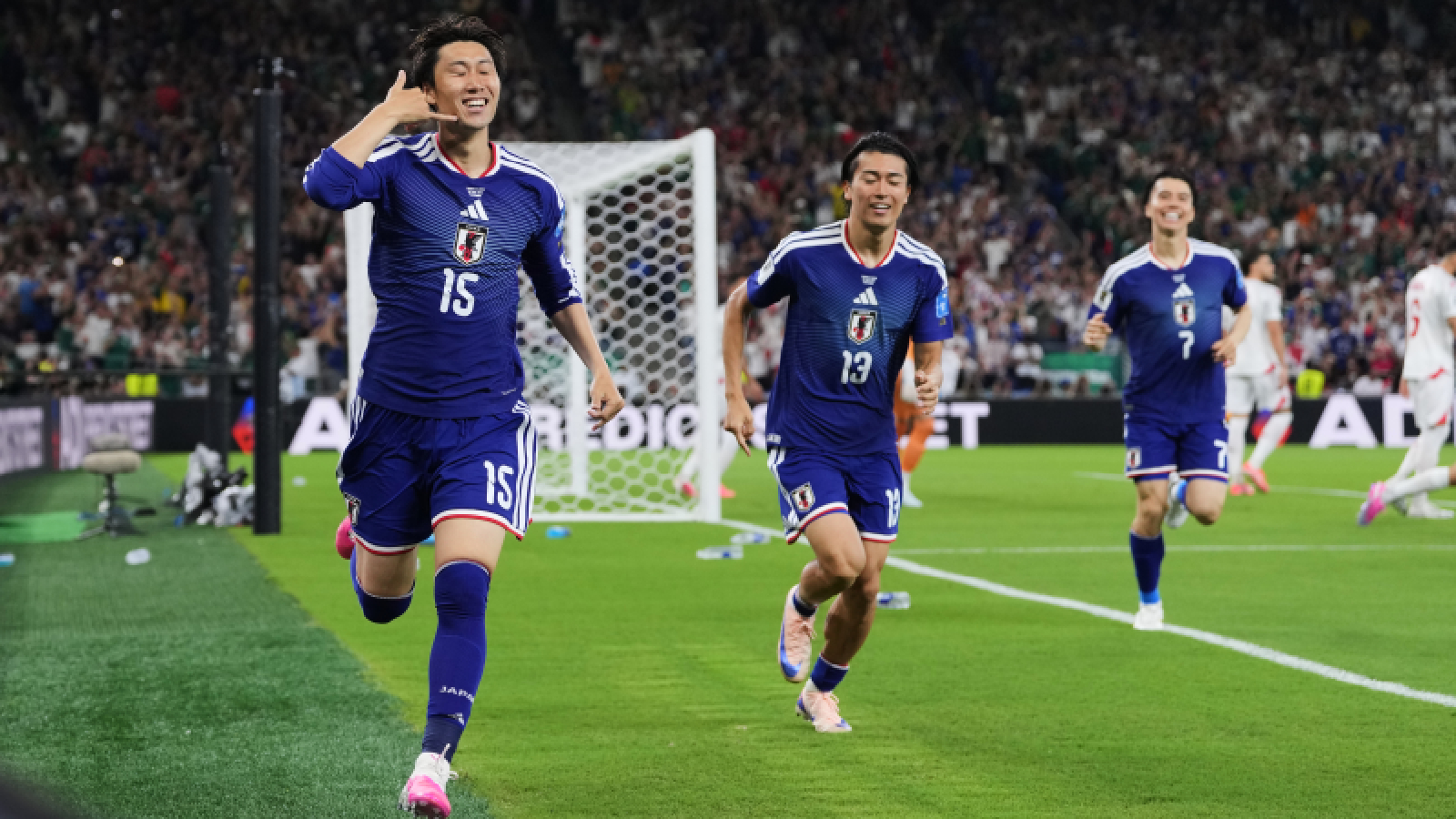 Japan's Daichi Kamada (15) celebrates scoring his side's first goal against Tunisia during the World Cup Group F soccer match in Guadalupe, near Monterrey, Mexico, Saturday, June 20, 2026. (AP Photo/Matias Delacroix)