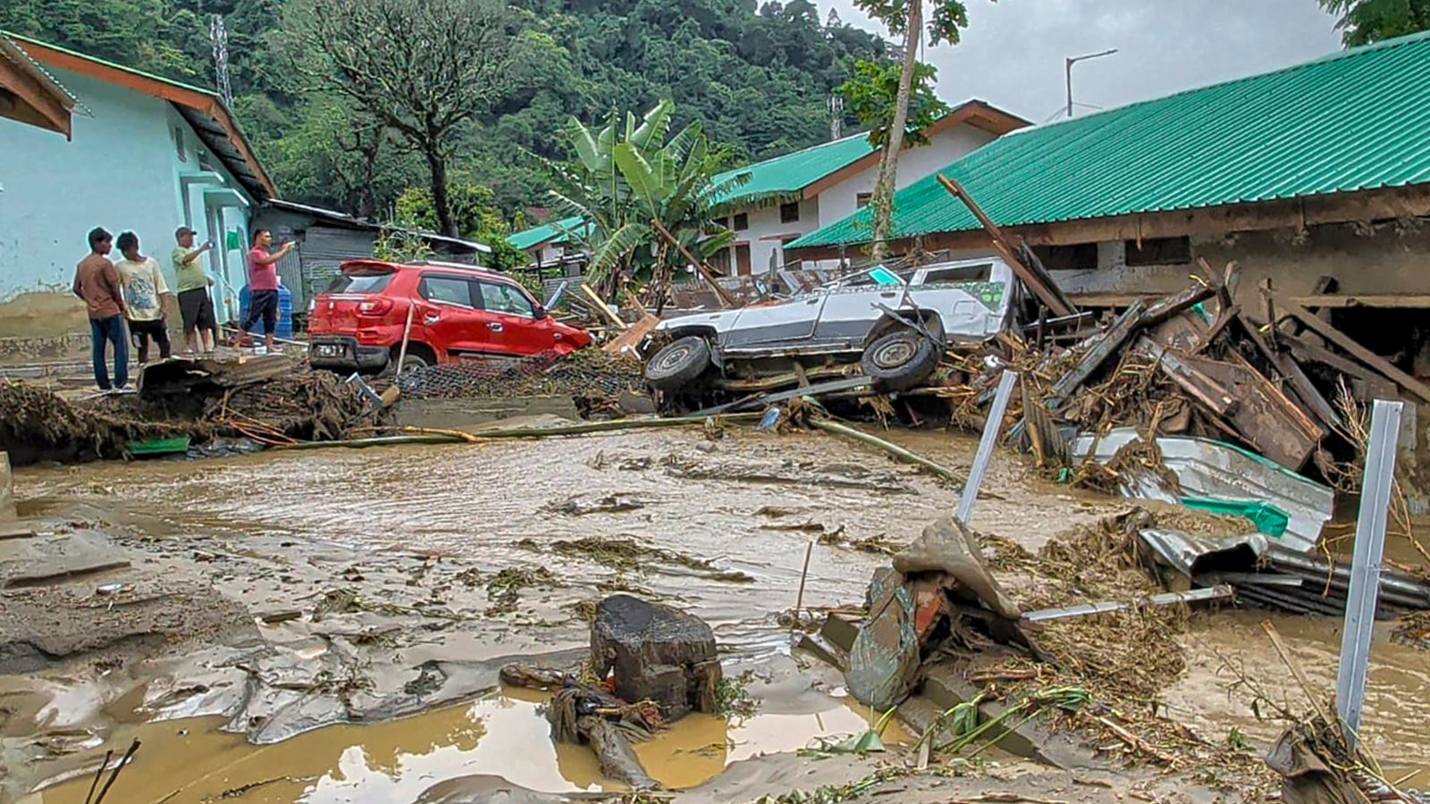  Vehicles stuck in debris after a landslide and flash floods near the NEEPCO project colony, Keyi Panyor district, Arunachal Pradesh, Wednesday, June 24, 2026. (PTI Photo)